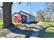 View of the colorful home showing the entrance, red accent wall and blue siding at 3142 N Euclid Ave, Indianapolis, IN 46218