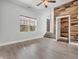 Bright living room featuring laminate floors, modern wall accents, and natural light at 317 Alden Way, Carmel, IN 46032