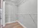 The closet has built-in shelving and hardwood floors at 317 Alden Way, Carmel, IN 46032