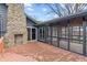 Outdoor deck features a stone chimney and transitions into a screened porch at 3244 Devereaux Dr, Indianapolis, IN 46228