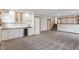 Finished basement wet bar with modern white cabinets and a wine fridge at 3244 Devereaux Dr, Indianapolis, IN 46228