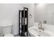 Bathroom featuring a vessel sink and shelving, creating stylish storage at 3244 Devereaux Dr, Indianapolis, IN 46228