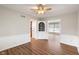 Bright living room features hardwood flooring and an arched doorway at 3244 Devereaux Dr, Indianapolis, IN 46228