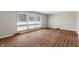 Spacious living room with hardwood floors and plenty of natural light at 3244 Devereaux Dr, Indianapolis, IN 46228