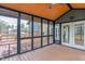 Inviting screened-in porch with wood flooring, perfect for outdoor enjoyment at 3244 Devereaux Dr, Indianapolis, IN 46228