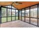 Cozy screened porch with a ceiling fan overlooking a landscaped backyard at 3244 Devereaux Dr, Indianapolis, IN 46228