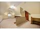 Finished attic with neutral carpeting, built in shelves, a window, and a ceiling fan at 331 W State St, Pendleton, IN 46064