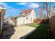 Exterior view of home showcasing a grassy backyard and a concrete patio at 331 W State St, Pendleton, IN 46064