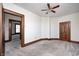 Spacious bedroom features neutral carpet, white walls with wood trim and multiple wood paneled doors at 331 W State St, Pendleton, IN 46064