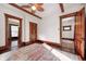 Spacious bedroom features original wood trim, ceiling fan, and doorway access to other rooms at 331 W State St, Pendleton, IN 46064