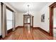 Charming dining room boasts hardwood floors, natural light, and elegant chandelier lighting at 331 W State St, Pendleton, IN 46064