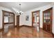 Bright dining room features hardwood floors, chandelier lighting, and classic wood trim details at 331 W State St, Pendleton, IN 46064
