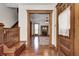 Attractive foyer with hardwood floors, detailed trim, and inviting open doorway to living room at 331 W State St, Pendleton, IN 46064
