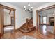 Spacious foyer featuring hardwood floors, detailed woodwork, and multiple entryways at 331 W State St, Pendleton, IN 46064