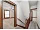 Upstairs hallway with light gray carpet and beautiful natural wood trim and doors at 331 W State St, Pendleton, IN 46064