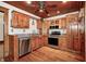 Cozy kitchen with custom wood cabinets, granite countertops, and stainless steel appliances at 331 W State St, Pendleton, IN 46064
