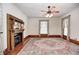 Cozy living room with hardwood floors, a fireplace, and large windows offering plenty of light at 331 W State St, Pendleton, IN 46064