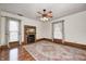 Bright living room featuring hardwood floors, a fireplace, and ample natural light at 331 W State St, Pendleton, IN 46064