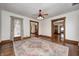 Open living room with hardwood floors, view to the exterior, and access to foyer and other rooms at 331 W State St, Pendleton, IN 46064