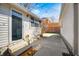 Concrete patio with string lights overhead and steps leading to a glass paneled door at 331 W State St, Pendleton, IN 46064
