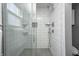 This bathroom shower features subway tile walls, mosaic floors, and modern chrome fixtures at 331 W State St, Pendleton, IN 46064