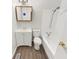 Clean bathroom featuring a vanity with storage, a toilet, and a shower-tub combination at 3662 Lombardy Pl, Indianapolis, IN 46226