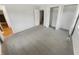 This bedroom is light and airy with gray carpeted floors and closet storage at 3662 Lombardy Pl, Indianapolis, IN 46226