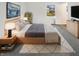 Comfortable bedroom with a cozy bed, stylish decor, and a view to the backyard at 3662 Lombardy Pl, Indianapolis, IN 46226