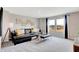 Stylish living room with gray carpeting, leather sectional, and large windows offering views of a construction site at 3721 Cantebury Dr, Franklin, IN 46131