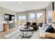 Bright living room featuring a comfortable seating area and a view of the community at 3721 Cantebury Dr, Franklin, IN 46131