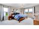 Spacious main bedroom features plush carpeting, a large window, and a comfortable bed at 3721 Cantebury Dr, Franklin, IN 46131
