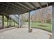 A concrete patio sits under the deck, leading into a spacious green backyard at 3892 Pelham Rd, Carmel, IN 46074