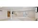 Finished basement with a bar area, carpeted floor, and access to the backyard at 3892 Pelham Rd, Carmel, IN 46074