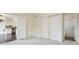 Cozy bedroom features neutral carpet, closet with sliding doors, and access to an en-suite bathroom and kitchen at 3892 Pelham Rd, Carmel, IN 46074