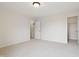 Neutral carpeted bedroom with an ensuite bathroom and closet at 3892 Pelham Rd, Carmel, IN 46074