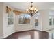 Breakfast nook with a bay window and access to outdoor deck at 3892 Pelham Rd, Carmel, IN 46074