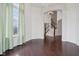 Elegant dining room area with large windows and open access to the stairway at 3892 Pelham Rd, Carmel, IN 46074