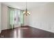 Formal dining room with hardwood floors, wainscoting, and a chandelier at 3892 Pelham Rd, Carmel, IN 46074