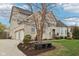 Lovely home with a three-car garage, brick facade, and manicured landscaping at 3892 Pelham Rd, Carmel, IN 46074