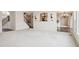 Open concept living room with hardwood floors and bright, white walls at 3892 Pelham Rd, Carmel, IN 46074
