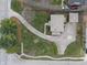 Aerial view of a brick home with a long driveway and detached garage at 3901 S Meridian St, Indianapolis, IN 46217
