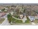 Aerial view of suburban neighborhood featuring a well-maintained brick home with large trees at 3901 S Meridian St, Indianapolis, IN 46217