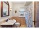 Bathroom featuring a tiled shower/tub, vanity with mirror, toilet, and a window at 3901 S Meridian St, Indianapolis, IN 46217
