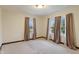 Bright bedroom with wall to wall carpet and charming curtains at 3901 S Meridian St, Indianapolis, IN 46217