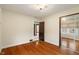 Cozy bedroom showcasing hardwood floors and a sliding closet mirror at 3901 S Meridian St, Indianapolis, IN 46217