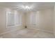Simple bedroom with wall-to-wall carpet and windows providing ample natural light at 3901 S Meridian St, Indianapolis, IN 46217
