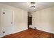Inviting bedroom features hardwood floors, neutral walls, and classic trim detail at 3901 S Meridian St, Indianapolis, IN 46217