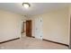Simple bedroom showcasing neutral carpet and two closets at 3901 S Meridian St, Indianapolis, IN 46217
