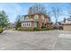 Two-story brick home with mature landscaping and detached garage at 3901 S Meridian St, Indianapolis, IN 46217