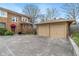 A view of the house and two-car garage with spacious driveway at 3901 S Meridian St, Indianapolis, IN 46217
